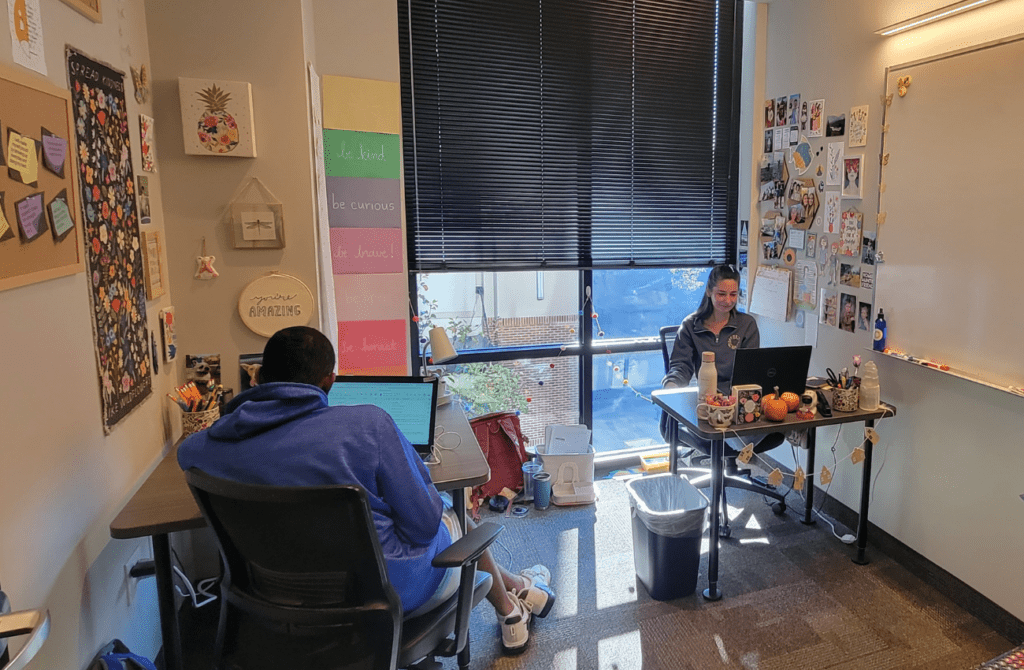 two students learning independently at desks