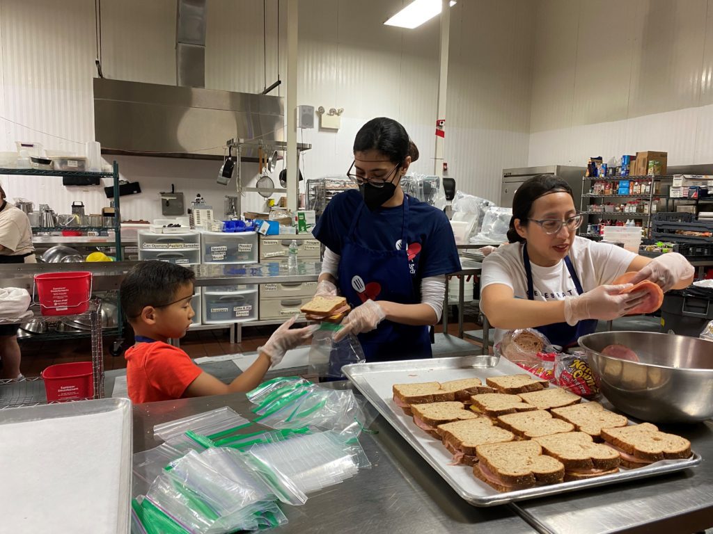 Mom and Kid and Sister Make Sandwiches