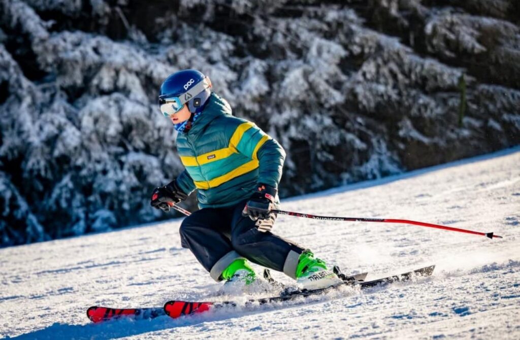A big kid carves the snow on skiis at Elk Mountain ski resort in PA. 
