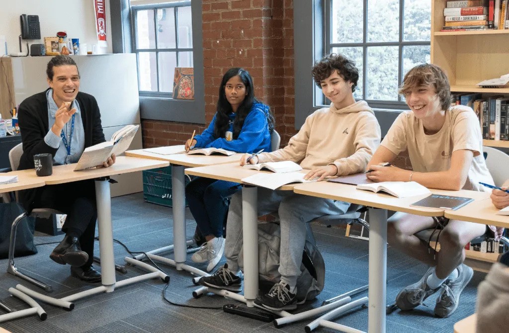 AIM Academy students attend a class with a teacher