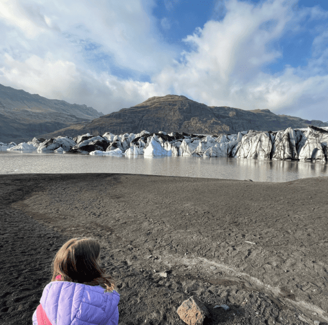 little girl looking at a glacier in Iceland