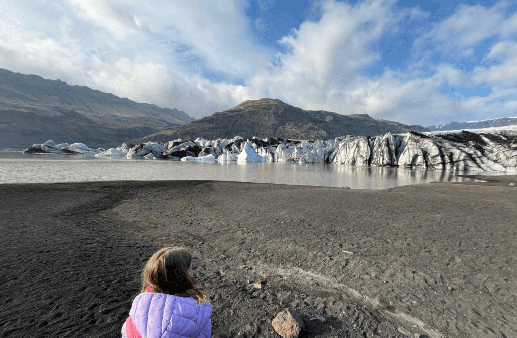 little girl looking at a glacier in Iceland