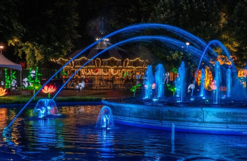 The glowing fountain and lanterns in Franklin Square at night.