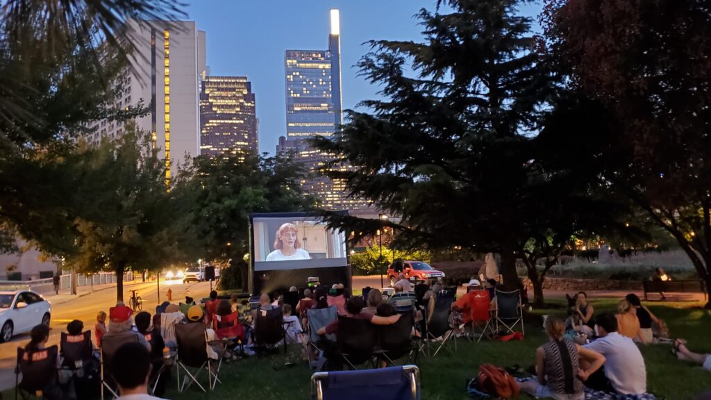 Neighbors in Philadelphia watching an outdoor movie