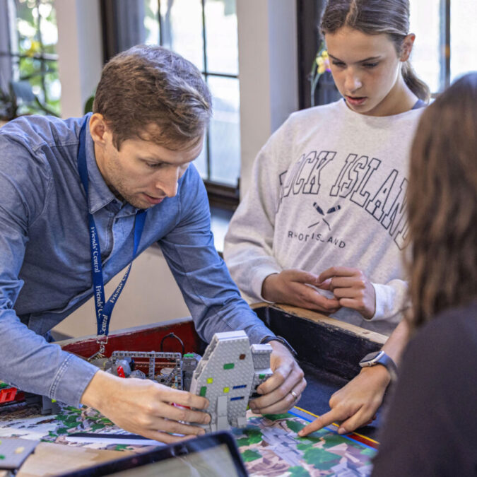 Friends Central school robotics teacher working with students