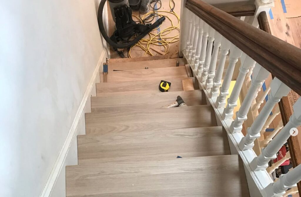 Artisan Wood Floors installs new hardwood on stairs in a Philly row home. 