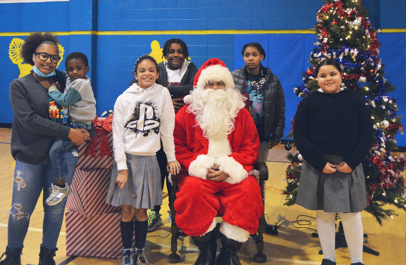 Santa and friends pose for a photo at the Police Athletic League PAL party.