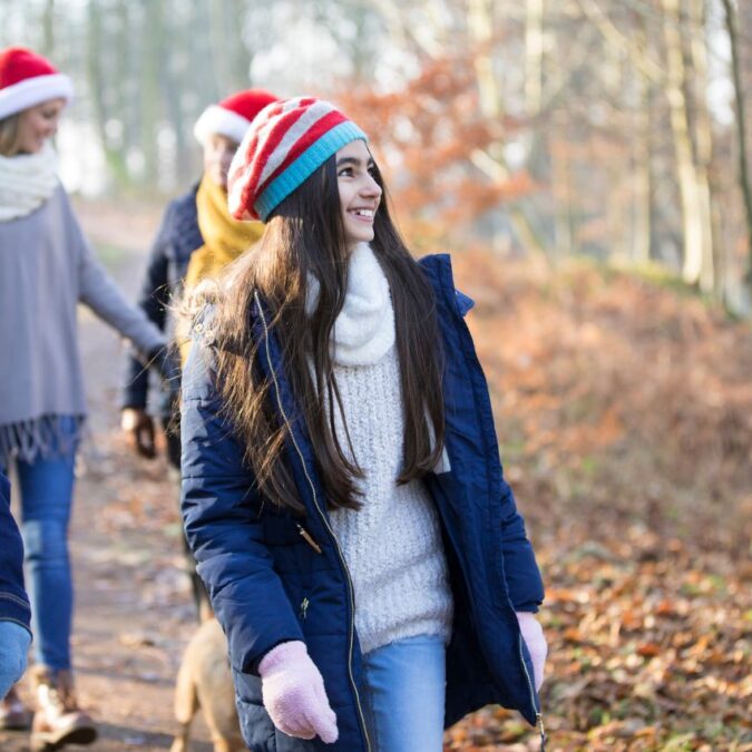 Manage your mental health during holiday gatherings by taking a walk.