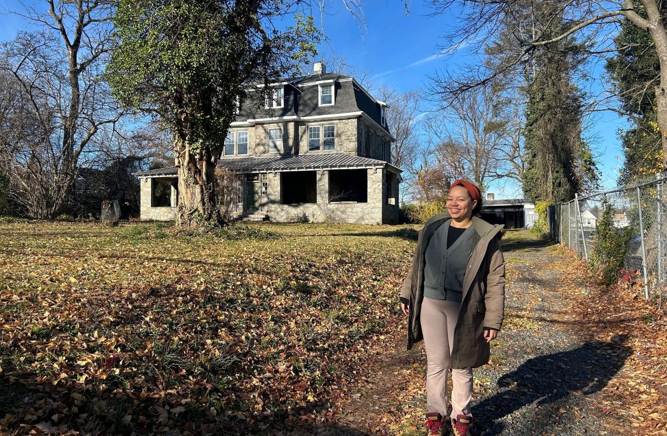 Philadelphia Midwife Collective director, Autumn Nelson stands in front of the Germantown house that will be the new birth center.